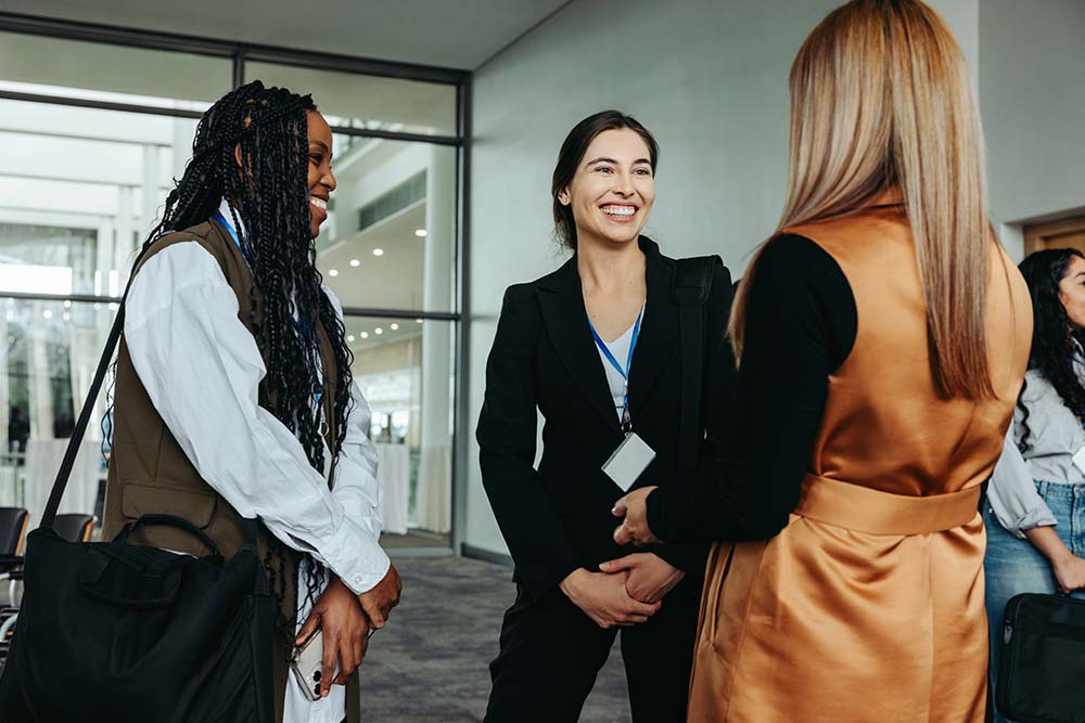 A group of small business owners networking while attending a trade show